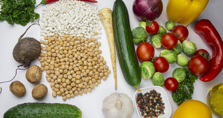 Homegrown vegetables. Fresh organic vegetables. Vegetables from garden. Colorful vegetable. Eggs, greens, beans, chickpeas. Healthy vegetable. A variety of vegetables and beans. View from above. isola