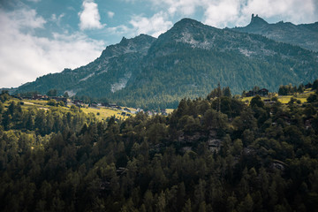 Small village in Switzerland. Traditional swiss landscape. Alps mountains in Switzerland