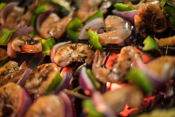 Close up of Shrimp been cooked at the grill with charcoal fire