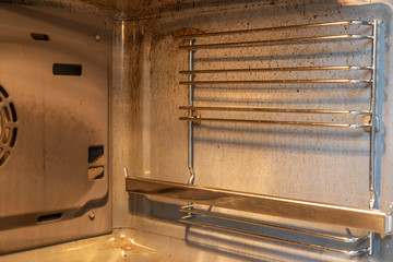 Dirty oven inside after cooking in a kitchen