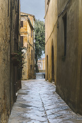 Walk on a rainy day through the streets of the beautiful town, Pienza, Tuscany