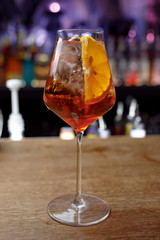 glass of white wine on wooden table