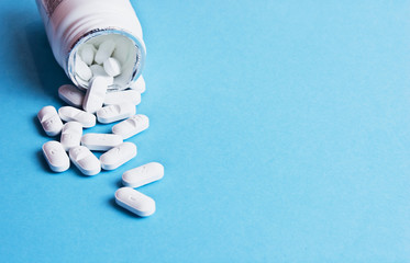 Pills close up. Medications for colds and flu. Infectious and respiratory infections. Capsules top view. Pain medication