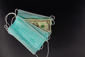 Antiviral surgical mask and money.