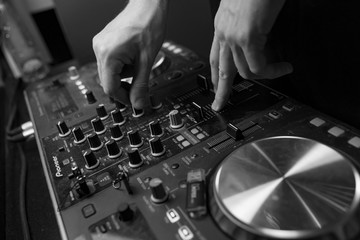 Obraz na płótnie Canvas dj mixing music in club