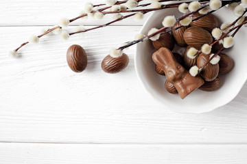 chocolate easter eggs on wooden background, copy space for text