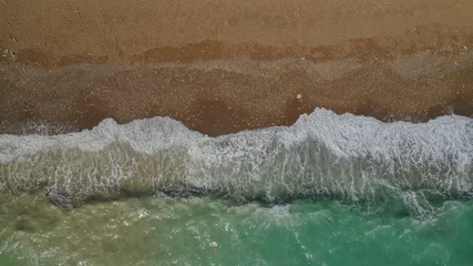 Foto op Canvas Aerial drone top view photo of emerald waves reaching sandy open ocean shore © aerial-drone