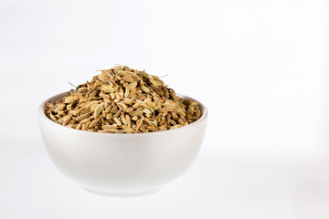 Fennel seeds in a small bowl - Foeniculum vulgare