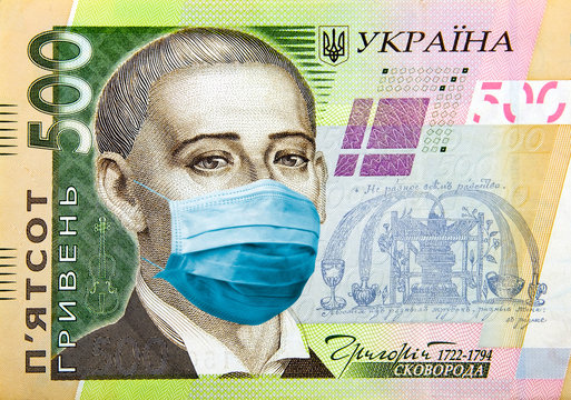 Coronavirus in Ukraine. Concept for quarantine and recession. 500 hryvnas banknote with a face mask against CoV infection. Digital montage.