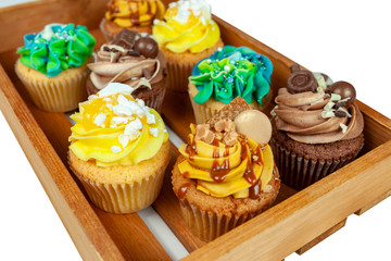 Wooden slated tray with delicious loaded cupcakes