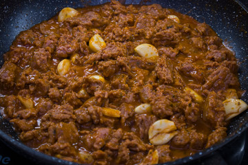 pasta cooking process spaghetti bolognese tomato paste meat and greens italian cuisine