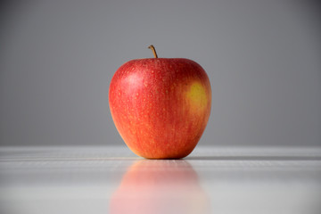 Apple on a white and grey background