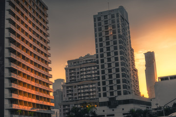 Fototapeta na wymiar Buildings in the City Lit by Golden Light at Sunset
