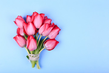 Bouquet of Pink Tulips and ribbon. Easter day background.