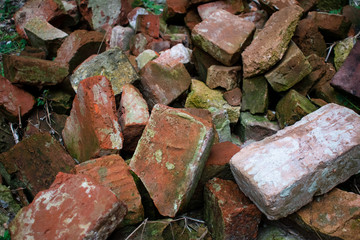 Old bricks scattered in the courtyard of a medieval castle