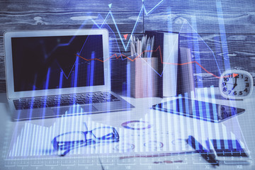 Multi exposure of graph and financial info and work space with computer background. Concept of international online trading.