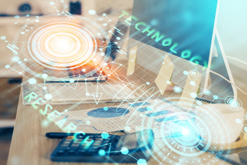 Double exposure of desktop computer and technology theme hologram. Concept of software development.