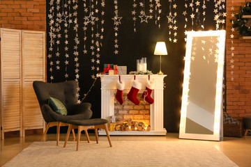 Interior of room with fireplace and Christmas decor