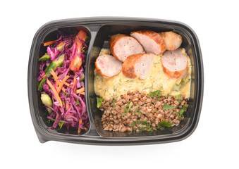 Container with healthy food on white background