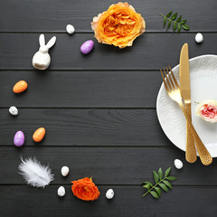 Beautiful Easter table setting on dark wooden background