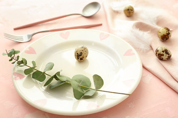 Beautiful Easter table setting on color background