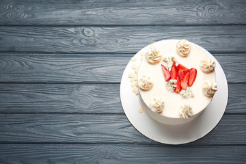 Tasty cake on wooden table