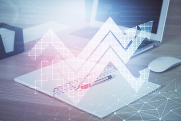 Computer on desktop with point up arrows hologram. Double exposure. Concept of success.