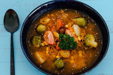 plant-based recipes, vegan spicy soup with fresh mixed veggies and brussel sprouts
