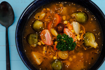 plant-based recipes, vegan spicy soup with fresh mixed veggies and brussel sprouts