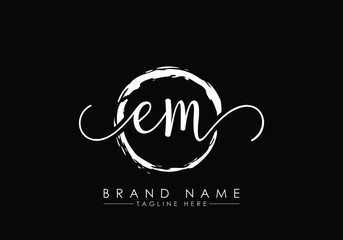 E and M Initial handwriting logo design with brush circle. handwritten logo for fashion, team, wedding, luxury logo.