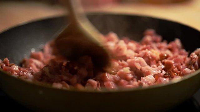 Becon frying in the pan, close-up footage