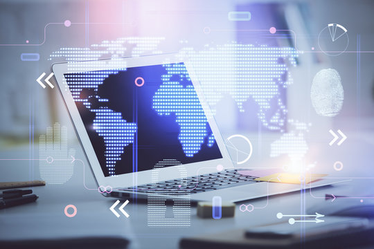Multi exposure of table with computer and world map hologram. International data network concept.