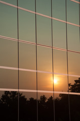 The evening sun reflected the glass of the building