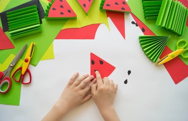 Fruit made of craft paper. Children's hands. © Дарья Колпакова