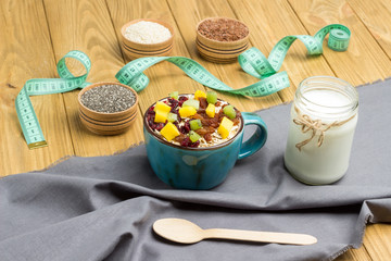 Muesli balanced breakfast. Fruits, berries seeds, nuts, coconut beverage, protein vegetarian food. Healthy Diet Plan