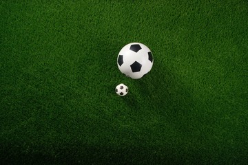 Soccer balls on the green grass. Concept World Cup. Flat lay. Copy space.