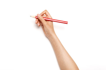 Woman hand hold a red pencil isolated on white.