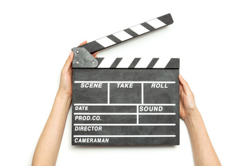 Woman hand hold a movie clapper isolated on white.