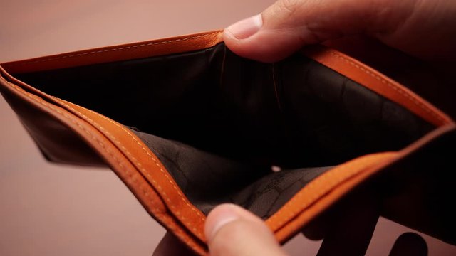 Bankruptcy - Man hand open an empty wallet in slow motion