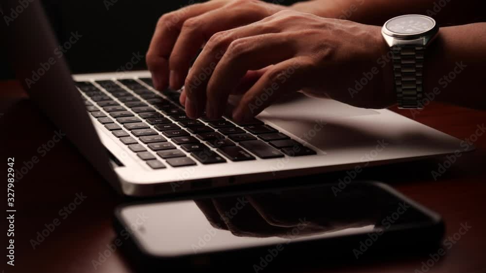 Aufkleber closeup of a businessman hands working and typing on laptop keyboard in slow motion