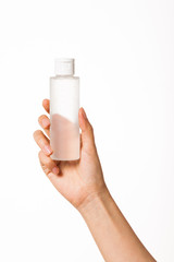 woman hand hold a cosmetic mock-up container isolated on white.