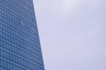 Fototapeta na wymiar Glass building Many windows. Background sky. Concept of corporation office, skyscraper.