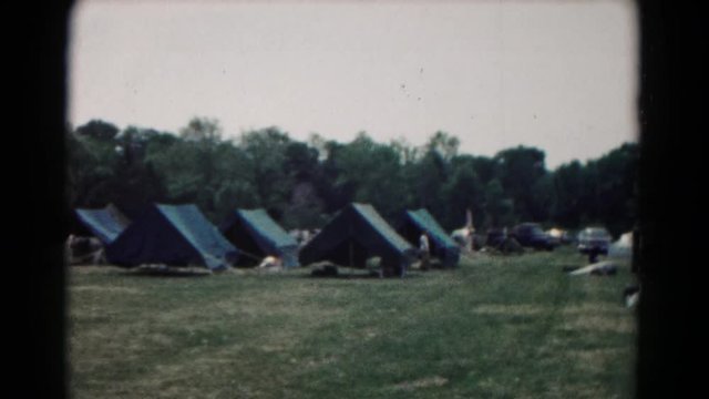 WASHINGTON CROSSING PENN-hing: Multiple Types Of Blue Green Tents Set Up Outside On Summer Day With Many Trees In Background