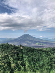 Bali, Indonesia - 27 April 2019 : Landscape nature view of Mt Agung, Mt Batur and Mt Abang and natural lake as tourist attraction point to have a breathtaking view