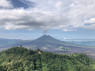 Fototapeta na wymiar Bali, Indonesia - 27 April 2019 : Landscape nature view of Mt Agung, Mt Batur and Mt Abang and natural lake as tourist attraction point to have a breathtaking view