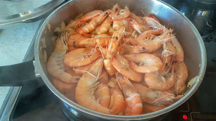 shrimp are fried in the pan