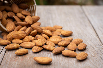  Almond nuts  isolated on wood table.