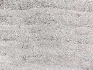 Fototapeta na wymiar Top view of texture fine sand beach in sunny day. Beautiful white sand surface for backgrounds and wallpapers