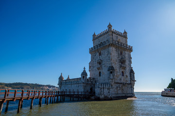 Fototapeta premium Majestic castle with wooden footbridge leading to entrance in sunless day