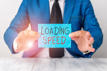 Text sign showing Loading Speed. Business photo showcasing time takes to download and display the content of a web page Man holds empty paper with copy space in front of him Copy Space